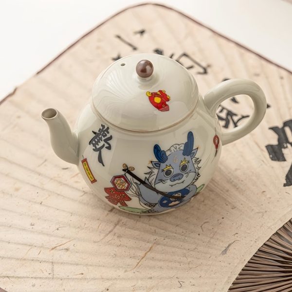 Vintage Porcelain Pear-Shaped Dragon Teapot Featuring Cute Cartoon Dragon Pattern