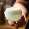 Traditional White Ceramic Hollow Carving Simplified Chinese Dragon Gongfu Tea Cup