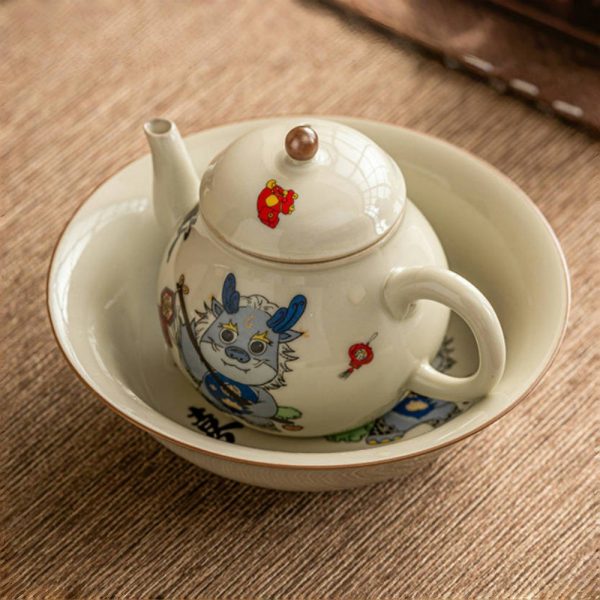 Vintage Porcelain Pear-Shaped Dragon Teapot Featuring Cute Cartoon Dragon Pattern