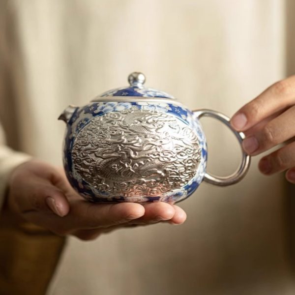 Vintage Ceramic Teapot With Blue And White Relief Pattern Featuring Silver Dragon And Phoenix