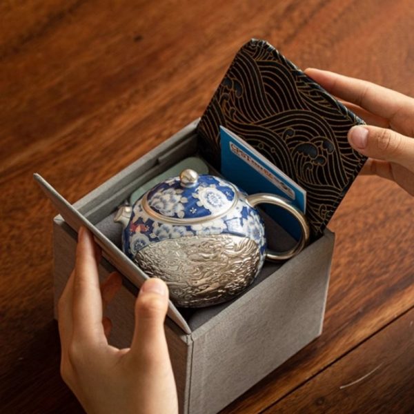 Vintage Ceramic Teapot With Blue And White Relief Pattern Featuring Silver Dragon And Phoenix